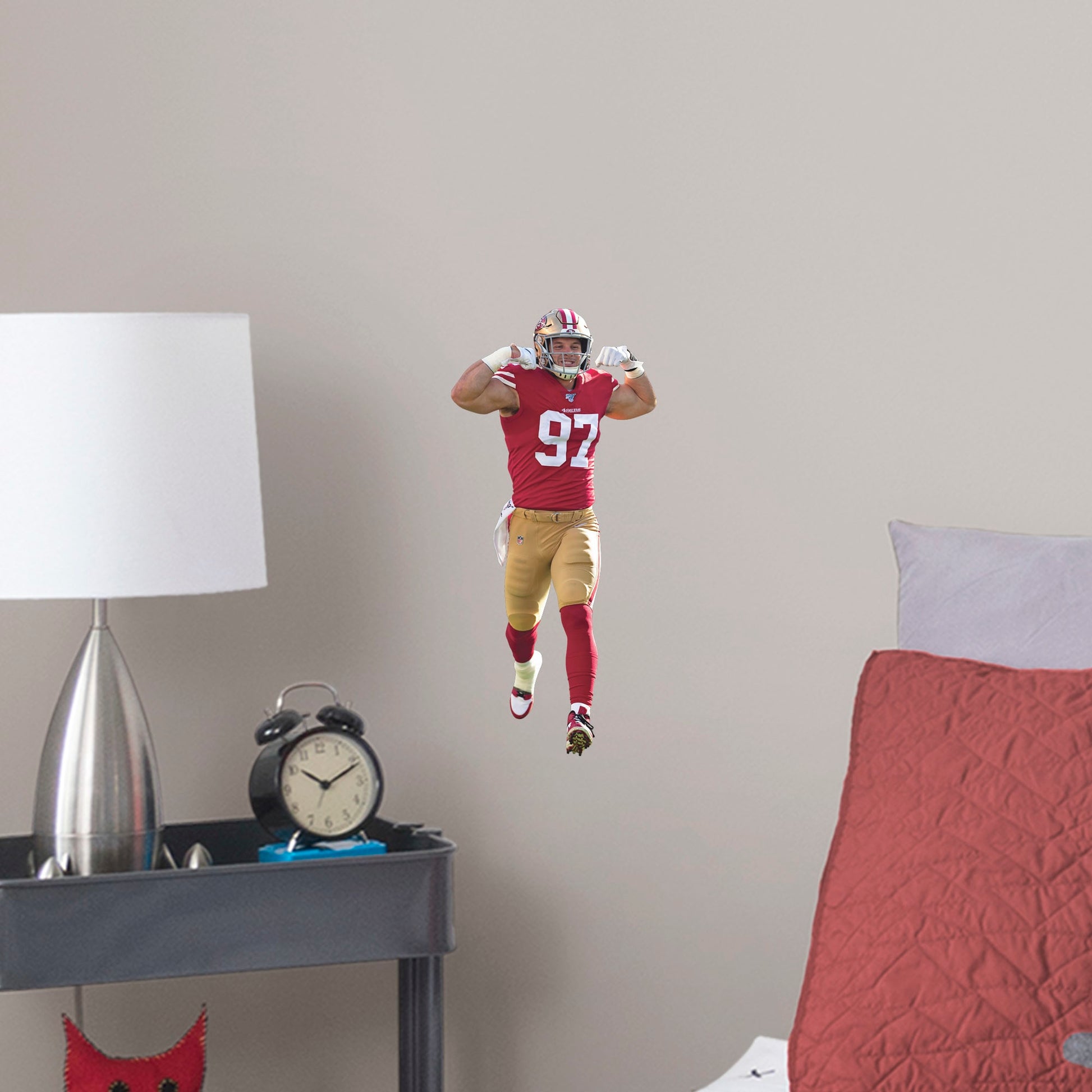 Large Athlete + 2 Decals (8"W x 16.5"H) Get personally flexed on by Nick Bosa with this unique officially licensed NFL wall decal! The 2019 Defensive Rookie of the Year likely has plenty of tackles ahead of him, and you can celebrate every one for years to come thanks to this high-quality graphic. The reusable design lets you move the Pro Bowl player wherever you choose, so you can celebrate in your bedroom, dorm room, or living room.