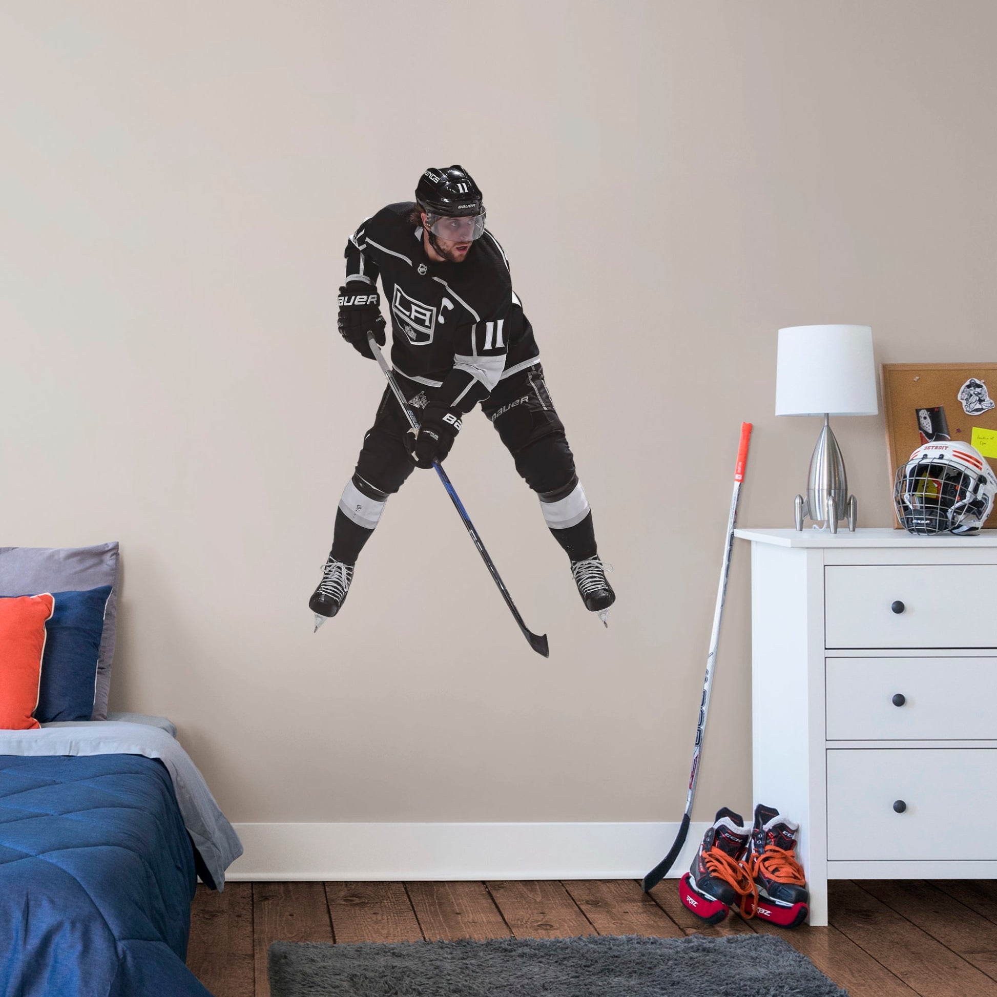 Large Athlete + 2 Decals (10"W x 17"H) NHL fans and Kings fanatics alike love Anze Kopitar, the clutch captain from Los Angeles, and now you can bring his skill to life in your own home! Seen here in his home uniform in action on the ice, this durable, bold, and removable wall decal will make the perfect addition to your bedroom, office, fan room, or any spot in your house! Let's Go Kings!