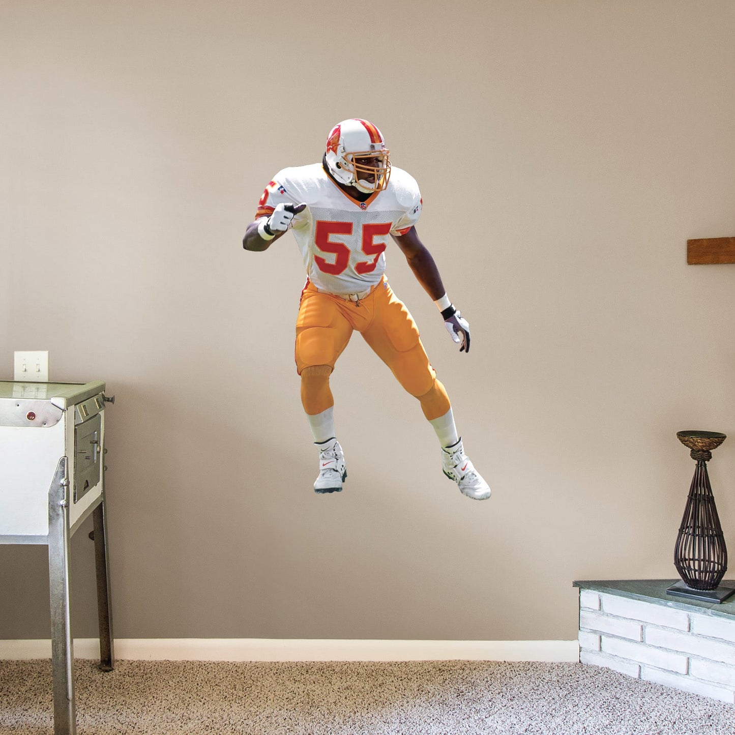Giant Athlete + 2 Decals (33"W x 51"H) Immortalize The Sheriff's amazing career on your wall with this officially licensed decal. Derrick Brooks' amazing accolades range from Super Bowl champion to his 11 Pro Bowl appearances, and he has rightfully taken his place in the Pro Football Hall of Fame. This high-quality decal makes a great gift, and it can be removed and reaffixed to walls as you decide on the best place to show off your Bucs pride for this legend's impressive impact on the sport.