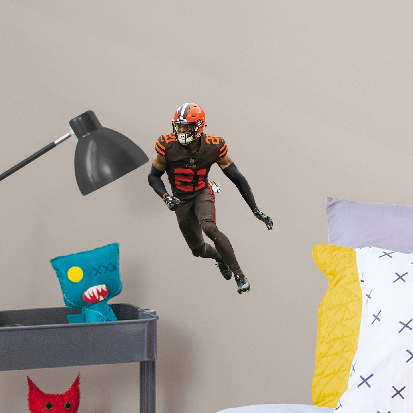Large Athlete + 2 Decals (11"W x 16"H) Bring the action of the NFL into your home with a wall decal of Denzel Ward! High quality, durable, and tear resistant, you'll be able to stick and move it as many times as you want to create the ultimate football experience in any room!