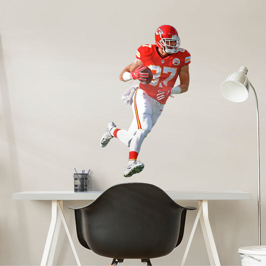 Bring the action of the NFL into your home with a wall decal of Travis Kelce! High quality, durable, and tear resistant, you'll be able to stick and move it as many times as you want to create the ultimate football experience in any room!