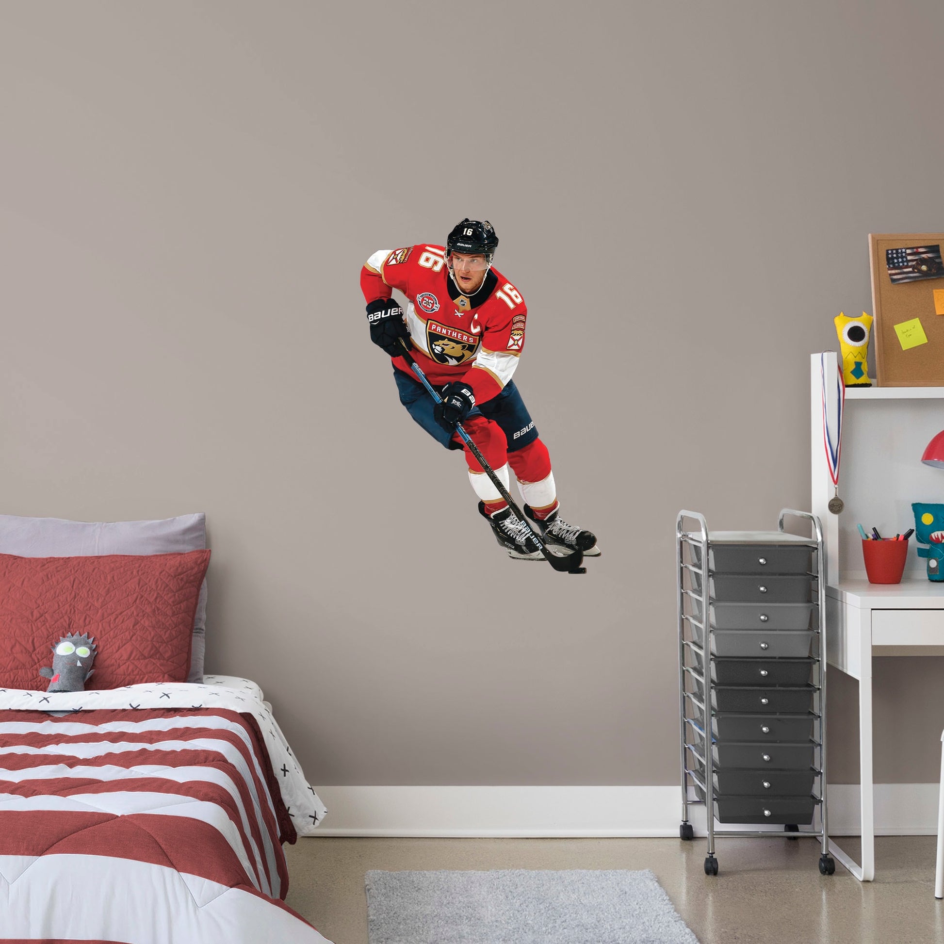 Life-Size Athlete + 2 Team Decals (51"W x 75"H) NHL fans and Panthers fanatics alike love Aleksander Barkov, the clutch captain from Florida, and now you can bring his skill to life in your own home! Seen here in action on the ice, this durable and bold wall decal will make the perfect addition to your bedroom, office, fan room, or any spot in your house! 