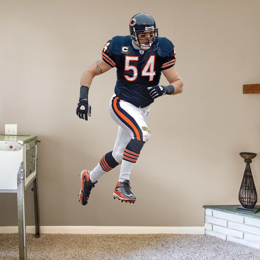 Life-Size Athlete + 2 Decals (43"W x 78"H) For 13 years, the Chicago Bears watched #54 earn his place as one of the Top 100 Bears of All time. Rep the navy blue and burnt orange with a high-grade vinyl decal of Da Bears legend Brian Urlacher. Removable, reusable, and tear-resistant, this Hall of Famer is great for bedrooms, man caves, or even as a temporary party decoration. Bear down, Chicago Bears!