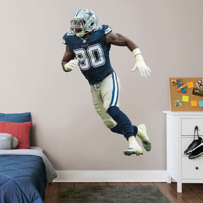 Life-Size Athlete + 2 Decals (47"W x 78"H) Show your support for one of the best defensive linemen in the NFL with this reusable DeMarcus Lawrence wall decal! This two-time Pro Bowler is quickly climbing his way up the all-time sacks list and is already one of the all-time great Dallas Cowboys players. This high-quality decal can be easily applied, removed, and reused so your support for DeMarcus Lawrence can follow you wherever you go!