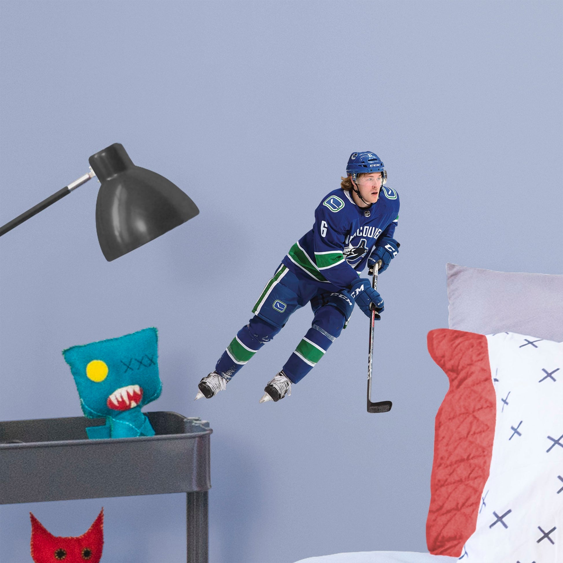 Large Athlete + 2 Decals (13"W x 16"H) Everyone loves Brock Boeser, the first round pick from the 2015 draft, and now you can bring him to life in your bedroom, office, or fan room with this Officially Licensed NHL Wall Decal. Skating to life in the Canucks home uniform, this removable wall decal of Boeser is sure to bring some action to your home, no matter how many times you need to move and restick it!