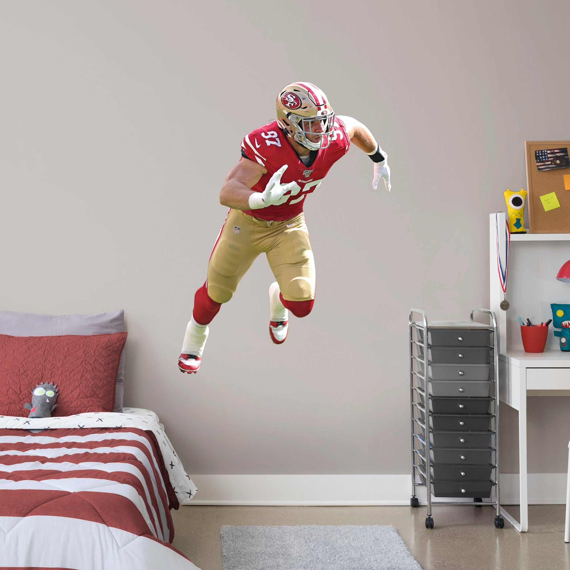 Giant Athlete + 2 Decals (35"W x 48"H) NFL pundits tagged Nick Bosa a can't-miss prospect, and Frisco's No. 2 draft pick dug deep and struck gold in 2019. Named the NFL Defensive Rookie of the Year, the sack master from Ohio State led the 49ers to the NFC title. Now you can honor one of Sourdough Sam's favorite sons with an officially licensed wall decal. Constructed from high-quality vinyl, the decal looks good in a bedroom or bonus room and is a no-brainer gift for any member of The Faithful.