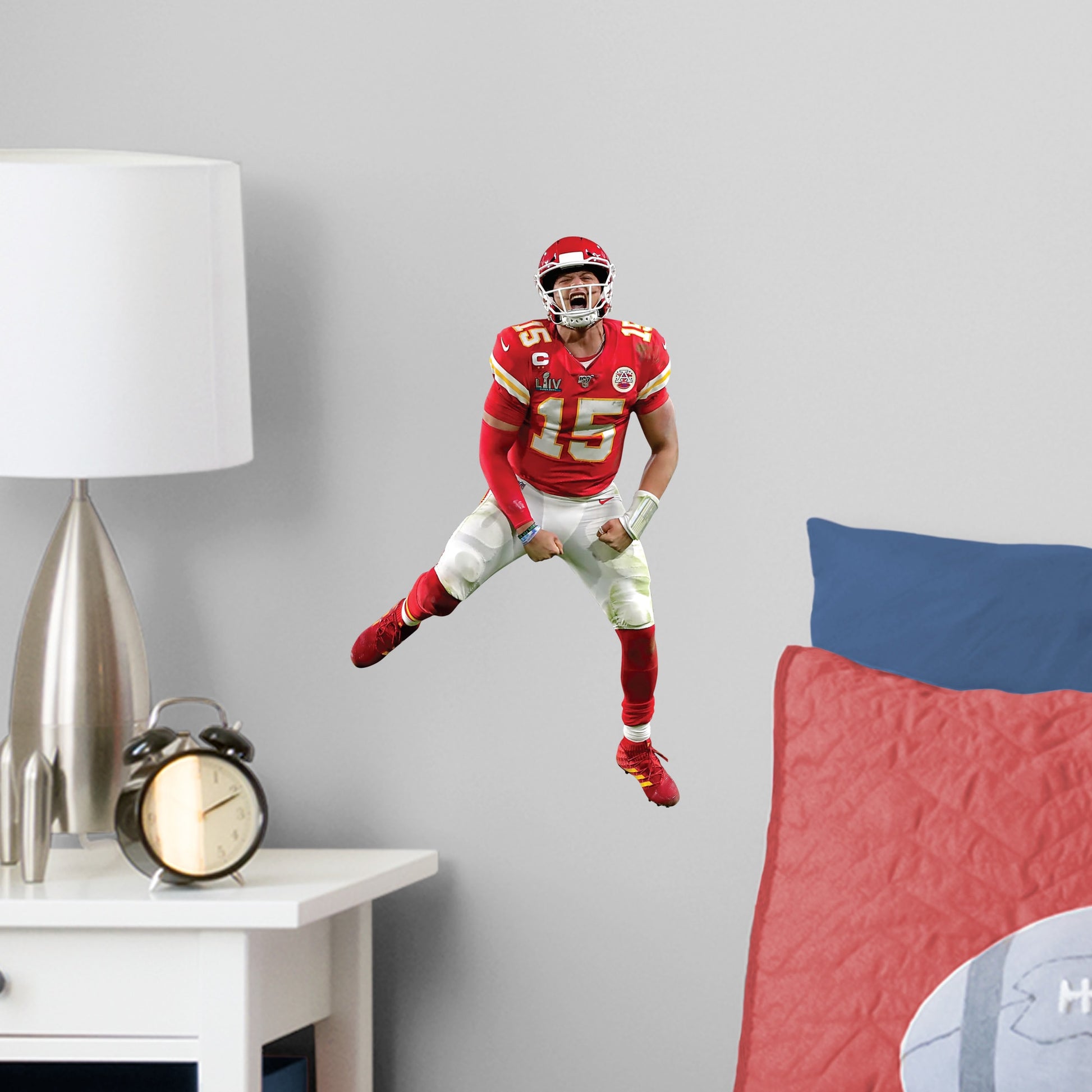 Large Athlete + 2 Decals (9"W x 16.5"H) Celebrate the Chiefs' epic Super Bowl LIV win over the 49ers with this high-quality, repositionable decal of MVP quarterback Patrick Mahomes celebrating the victory. Featuring plenty of the Chiefs' red and gold, this enthusiastic Magic Mahomes decal will brighten every day of your week. It's perfect for dorms, bedrooms, and sports bars because this durable, reusable Mahomes decal only damages the competition, not your walls.