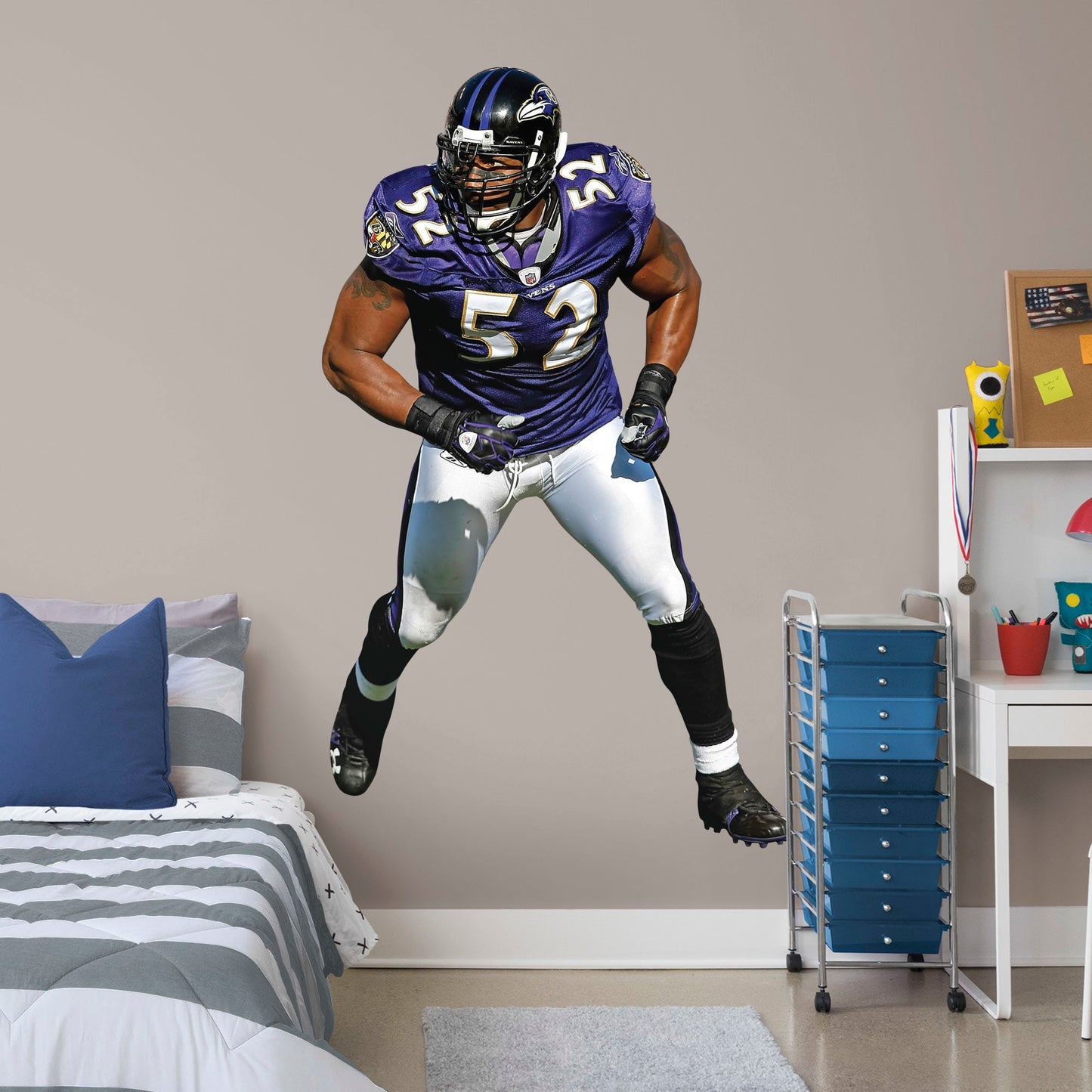 Life-Size Athlete + 2 Decals (47"W x 78"H) He’s the second linebacker ever to win the NFL’s Super Bowl MVP Award, and now, Brickwall, a.k.a. Ray Lewis, is ready for the bedroom, living room or locker room. This rugged, removable wall decal features the full figure of two-time Super Bowl champion No. 52 in his black, purple and metallic gold Baltimore Ravens best. Go Ravens!