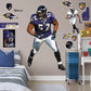 Life-Size Athlete + 12 Decals (47"W x 78"H) He's the second linebacker ever to win the NFL's Super Bowl MVP Award, and now, Brickwall, a.k.a. Ray Lewis, is ready for the bedroom, living room or locker room. This rugged, removable wall decal features the full figure of two-time Super Bowl champion No. 52 in his black, purple and metallic gold Baltimore Ravens best. Go Ravens!