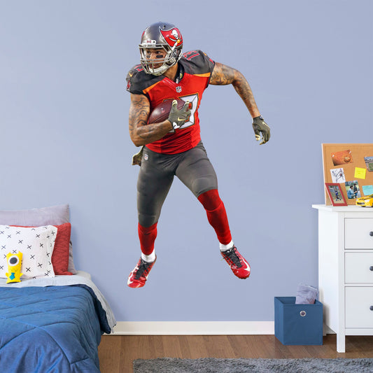 Life-Size Athlete + 13 Decals (42"W x 78"H) Bring the action of the NFL into your home with a wall decal of Mike Evans! High quality, durable, and tear resistant, you'll be able to stick and move it as many times as you want to create the ultimate football experience in any room!