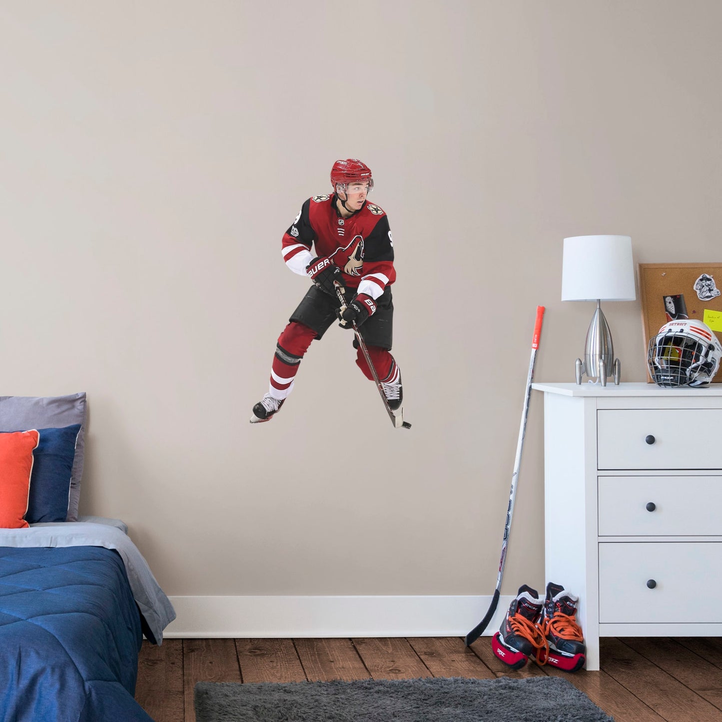 X-Large Athlete + 1 Decal (23"W x 39"H) Drafted seventh overall in the 2016, left wing player Clayton Keller is melting ice at Gila River Arena in Glendale. Cheer on Kellsy as he leads the Coyotes on to another championship with this distinctive colorful officially licensed NHL wall decal. Make a slap shot on a wall in your home, office, or coyote fan-den with this giftable reusable NHL decal. Perfect gift idea for a fan!