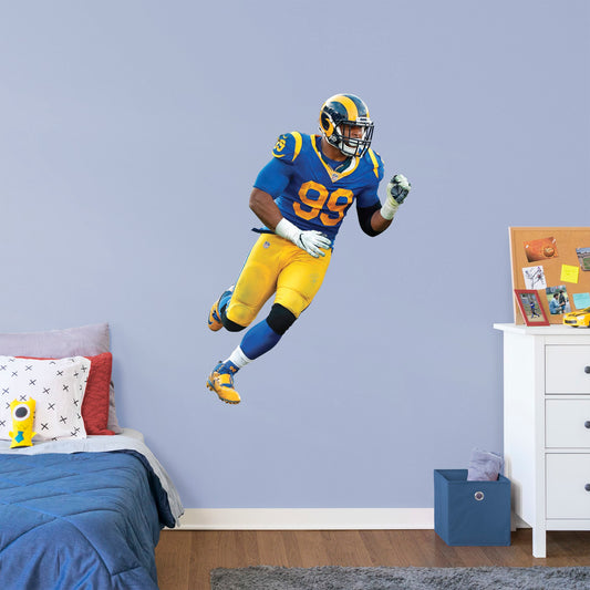 Giant Athlete + 2 Decals (34"W x 51"H) Ever wish you could meet Aaron Donald, one of the greatest defensive tackles in football history? Show your Los Angeles Rams team spirit with a life-size wall decal of the former Pittsburgh player once recognized as a unanimous All-American draft pick. Officially licensed by the NFL, this removable, high-quality Aaron Donald Throwback Jersey decal will show your Rams pride like no poster can.