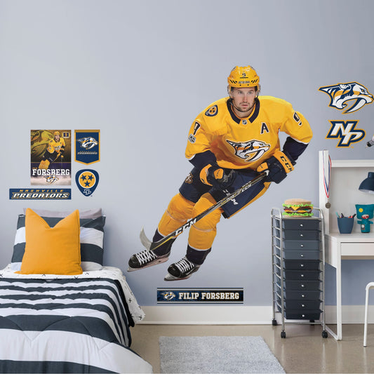 Life-Size Athlete + 9 Decals (61"W x 71"H) Filip Forsberg has been a force in the NHL since he was first drafted in 2012 and now you can bring him to life in your home with this Officially Licensed NHL Removable Wall Decal! Pictured here in action on the ice, this durable and reusable wall decal is sure to standout in your bedroom, office, or fan room!