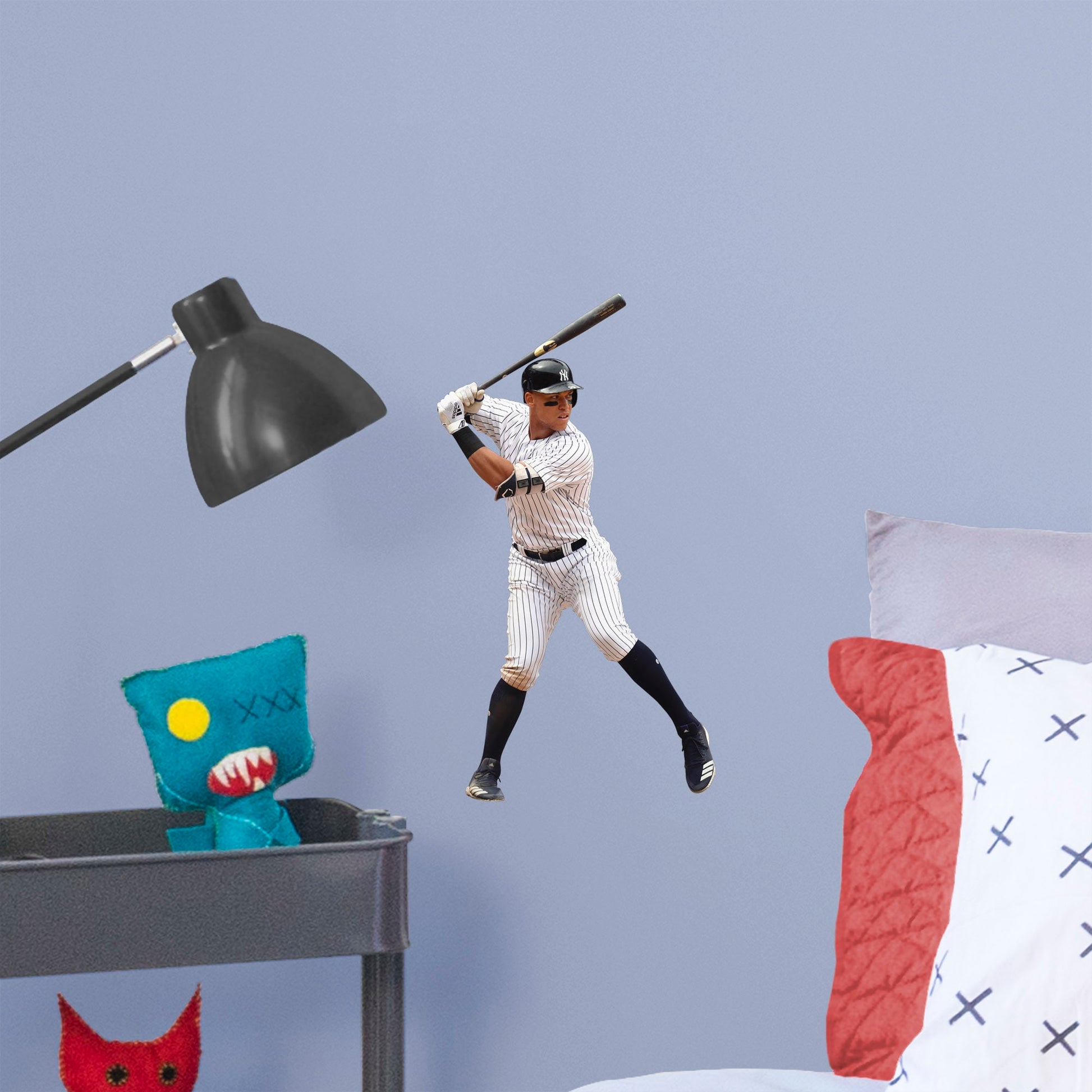 Large Athlete + 2 Decals (9"W x 17"H) Feed your inner sports fanatic with this unique Aaron Judge wall decal. Perfect for unseasoned Yanks or lifelong season-ticket holders, the reusable image of the 2017 Rookie of the Year pick can be moved from room to room with ease. The verdict is in: this adhesive graphic is perfect die-hard fans of The Judge.