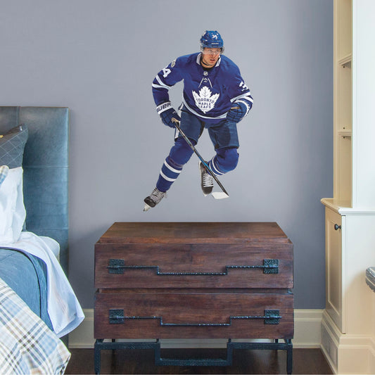 Toronto fans know that the opposing team should be scared when Auston Matthews hits the ice, and now you can bring that action to life in your own home with this Officially Licensed NHL Removable Wall Decal! This removable and reusable decal is bold and durable, making it the perfect addition to your bedroom, office, or fan room. Go Maple Leafs!
