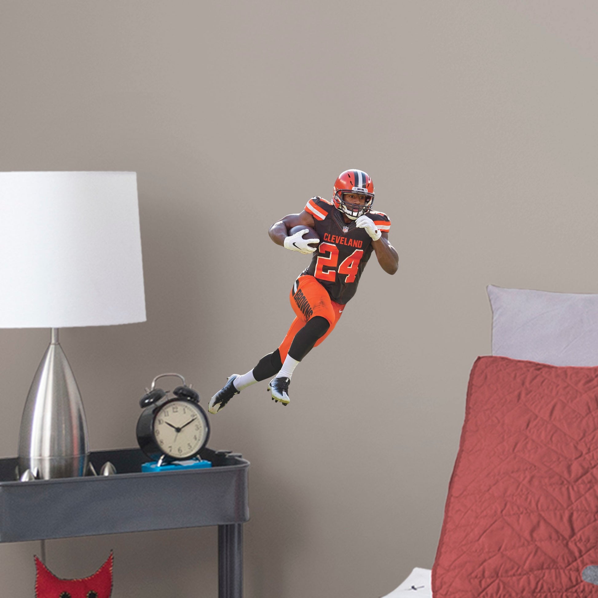 X-Large Athlete + 2 Decals (28"W x 36"H) Your favorite running back has the ball and is zooming down the field in this dynamic, photo-real wall decal. Celebrate Nick Chubb's brilliant career, from winning SEC Freshman of the Year back at Georgia to his 2019 Pro Bowl appearance with the Browns. This is a high-quality gift for any fan who can't wait to see No. 24 dance through the defenders in his next game.