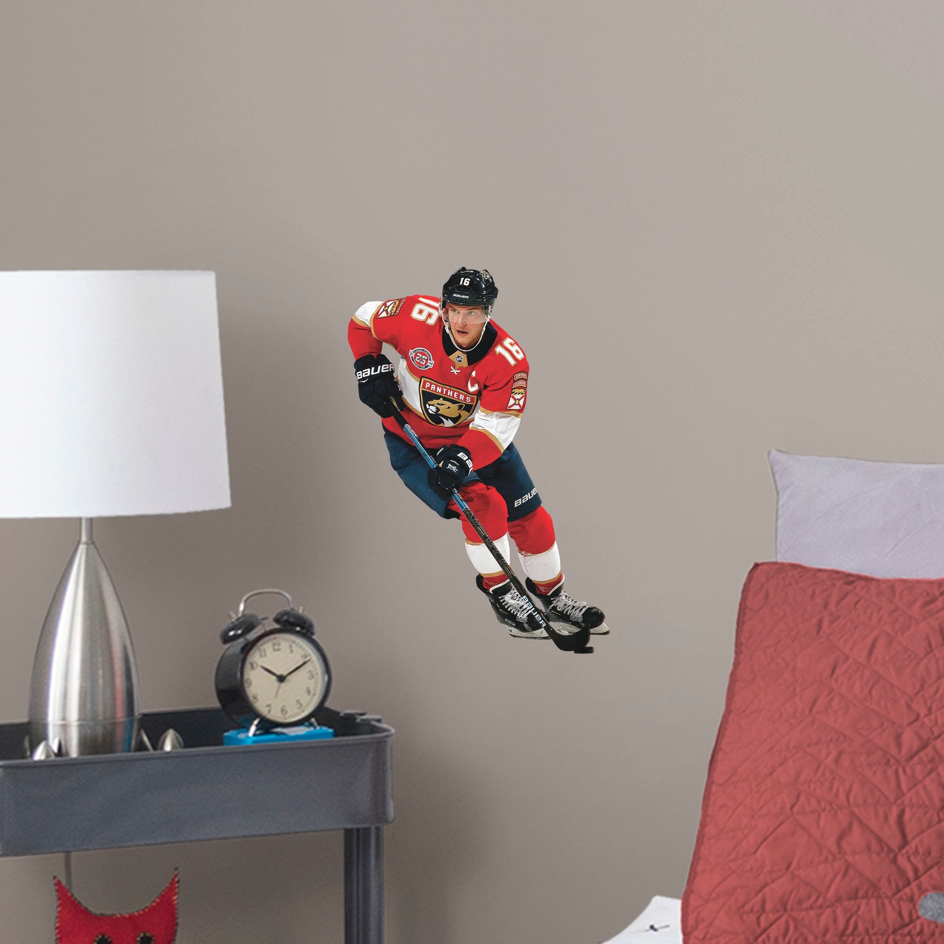 Giant Athlete + 2 Team Decals (36"W x 78"H) NHL fans and Panthers fanatics alike love Aleksander Barkov, the clutch captain from Florida, and now you can bring his skill to life in your own home! Seen here in action on the ice, this durable and bold wall decal will make the perfect addition to your bedroom, office, fan room, or any spot in your house! 