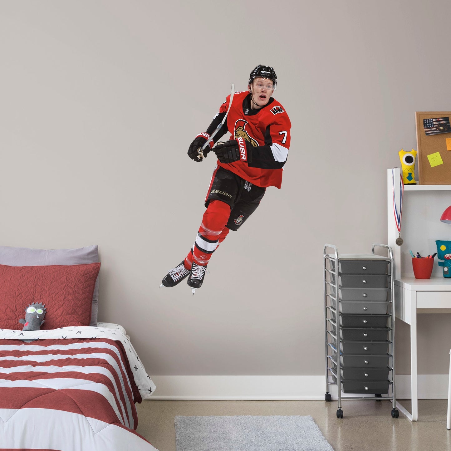Giant Athlete + 2 Team Decals (29"W x 51"H) Power forward Brady Tkachuk quickly made his mark in the NHL when he lead the Senators to victory, and now he's skating to life in your office, bedroom, or fan room in this Officially Licensed NHL wall decal. Ottawa fans and NHL fanatics alike will love the touch of action that Tkachuk brings, and this durable and removable wall decal will definitely stand up to the challenge, no matter how many times you restick it!