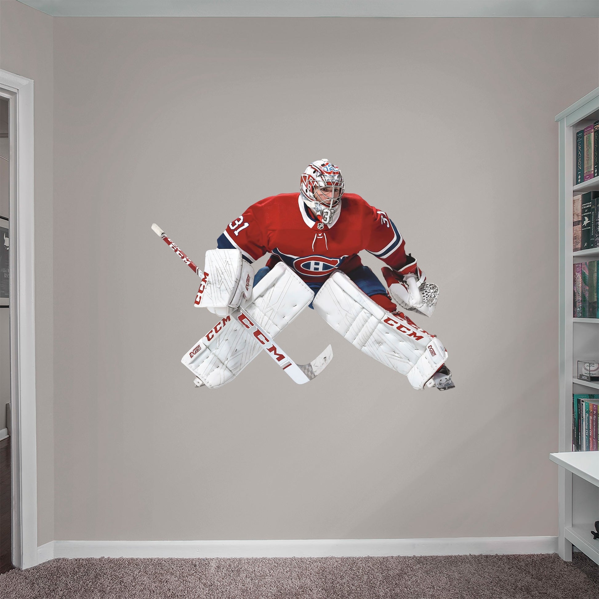 Giant Athlete + 2 Team Decals (50"W x 38"H) Featuring the repeat NHL All-Star - widely considered the greatest goaltender in the world - tending the goal in his trademark butterfly style, this reusable, high-quality decal resists rips, tears, and scoring attempts - and it won't damage the walls.
