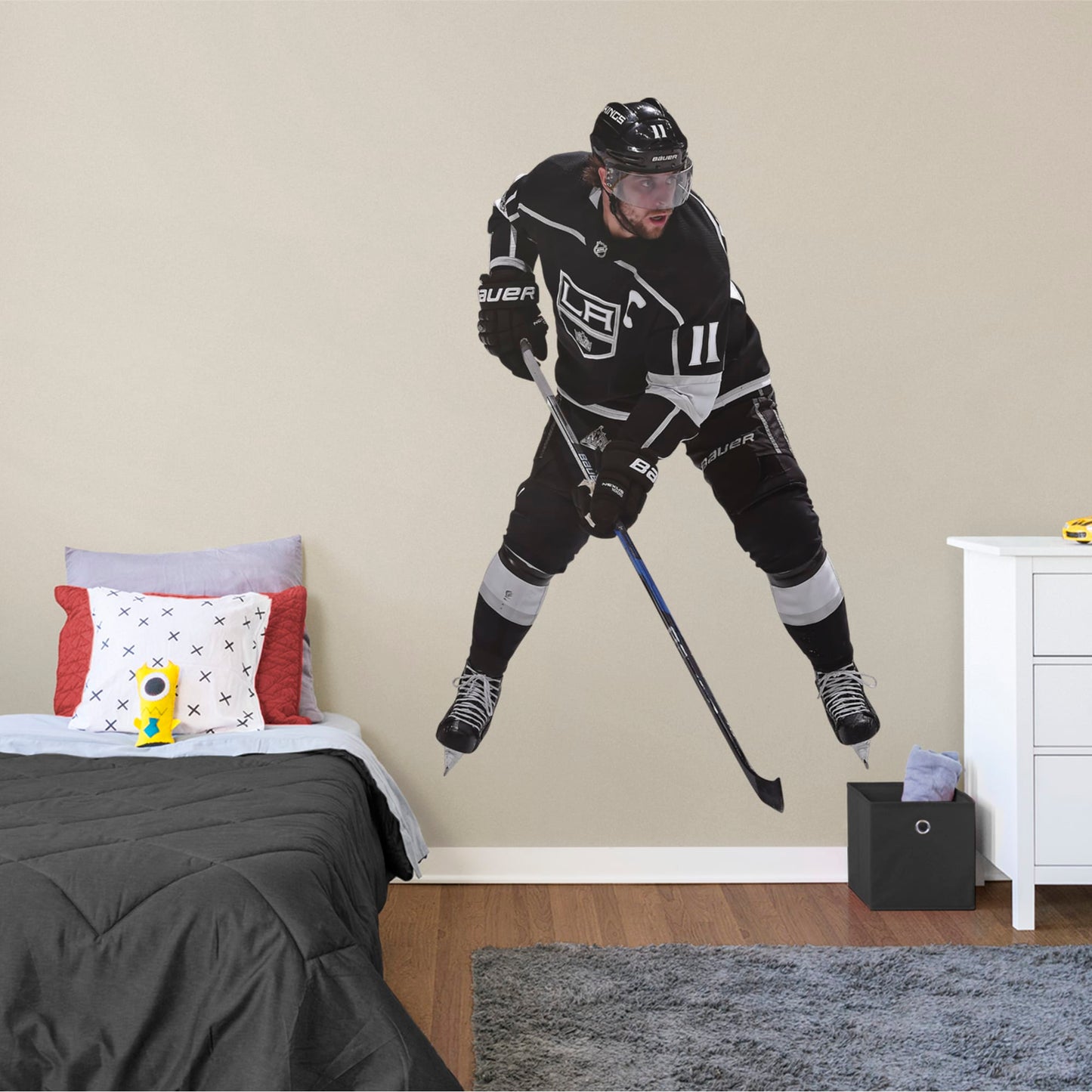 Life-Size Athlete + 2 Decals (46"W x 75"H) NHL fans and Kings fanatics alike love Anze Kopitar, the clutch captain from Los Angeles, and now you can bring his skill to life in your own home! Seen here in his home uniform in action on the ice, this durable, bold, and removable wall decal will make the perfect addition to your bedroom, office, fan room, or any spot in your house! Let's Go Kings!