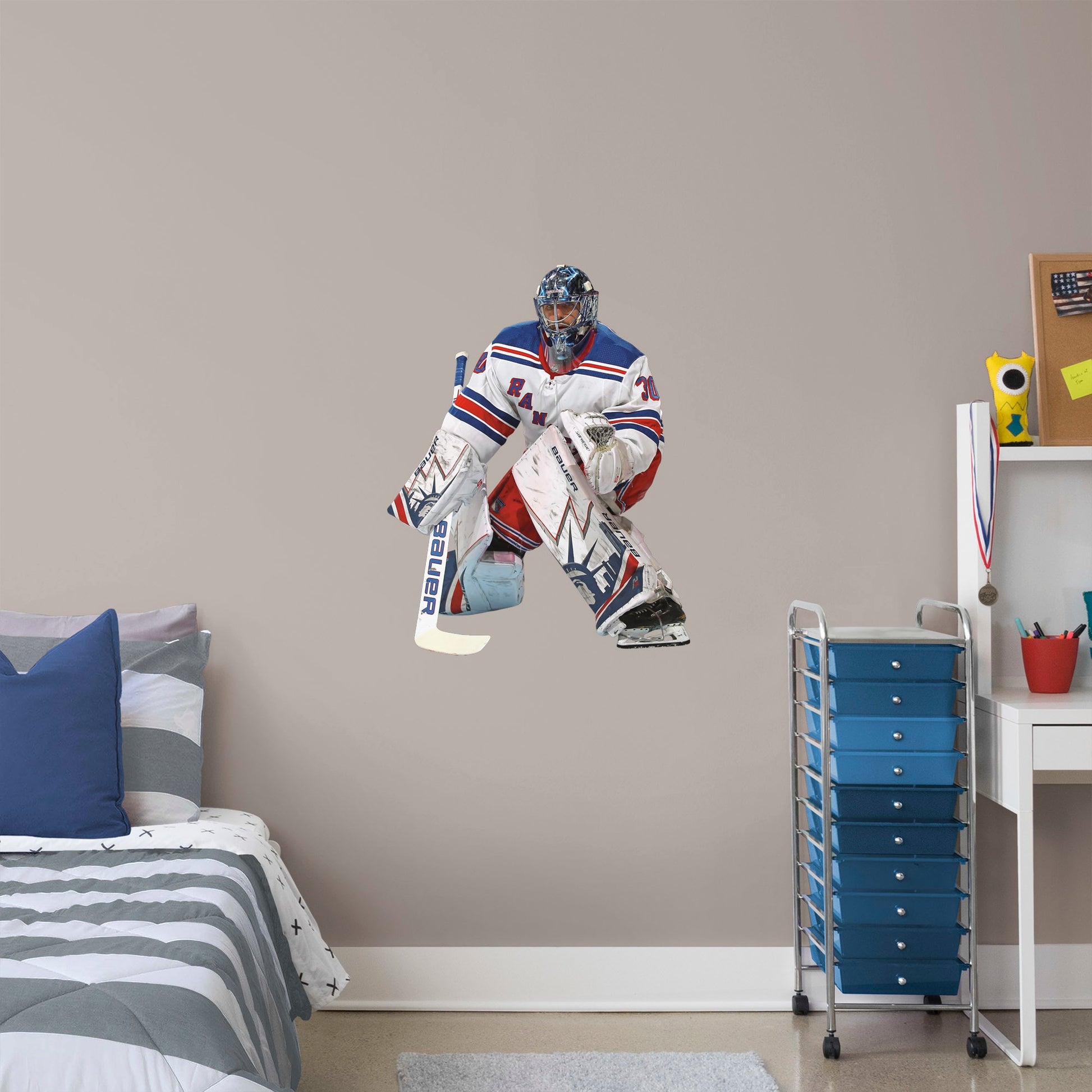 X-Large Athlete + 2 Decals (25"W x 32"H) Nothing gets past The King! Celebrate the impressive goaltending career of Henrik Lundqvist with this sturdy removable wall decal set depicting him poised to stop that puck. The gold-medal-winning hockey player looks great on any office or bedroom wall, and, unlike this goalie, the decal can be repositioned over time. It's also a great gift for anyone who appreciates Lundqvist's unique approach to tending goal!