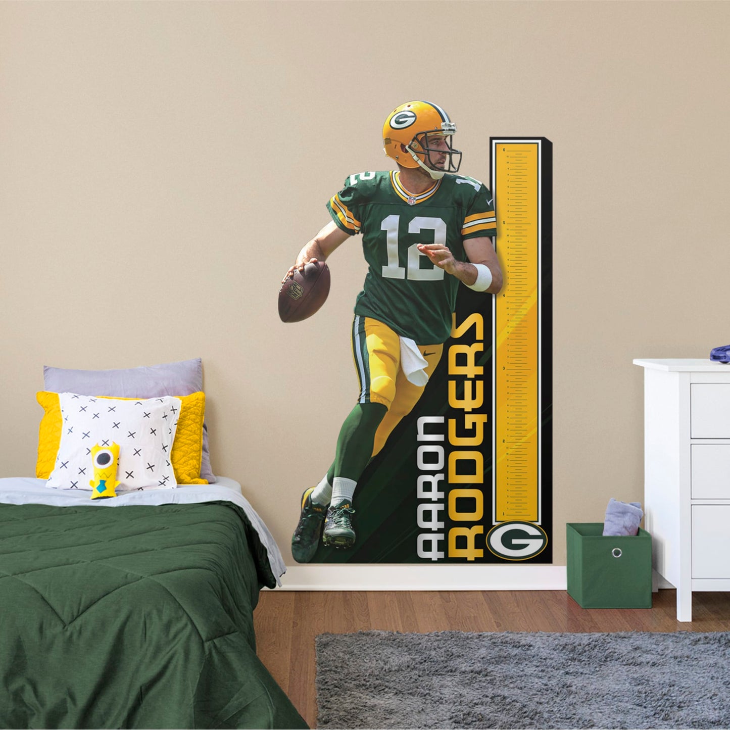 Turn your home into Mr. Rodger's Neighborhood with a durable vinyl wall decal of two-time NFL MVP Aaron Rodgers. Scouring the field for an open Green Bay receiver, A-Rodg is poised to notch another Packer TD. Easy to attach and remove, the life-size growth chart decal featuring one of Lambeau Field's greats is well-suited for a bedroom, media room, or in-home office.