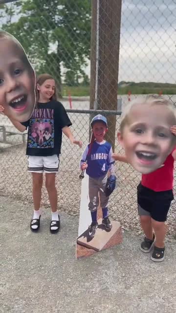 Kids showing off their custom Fathead cutouts